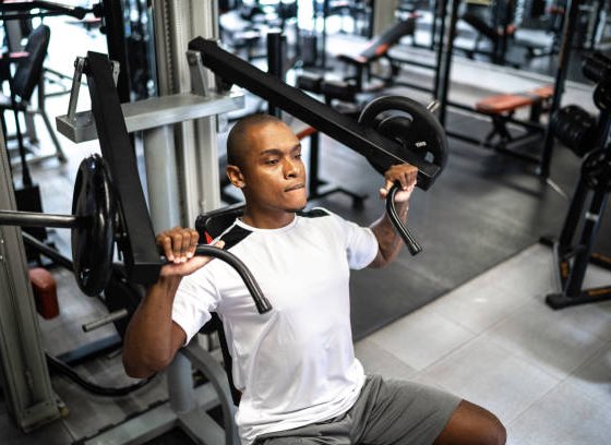 Man doing strength workout exercise in gym